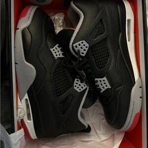 Men’s Black and Red Jordan 4 Breds